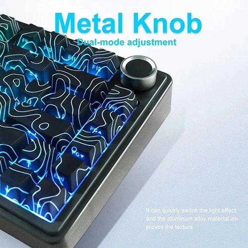 Aula-f75-wireless-tri-mode-rgb-75-percent-mechanical-gaming-keyboard-with-star-vector-switch-6 Close-up of a keyboard with a metal knob and blue illuminated keys, showing the product name 'metal knob' and the subtitle 'dual-mode adjustment'